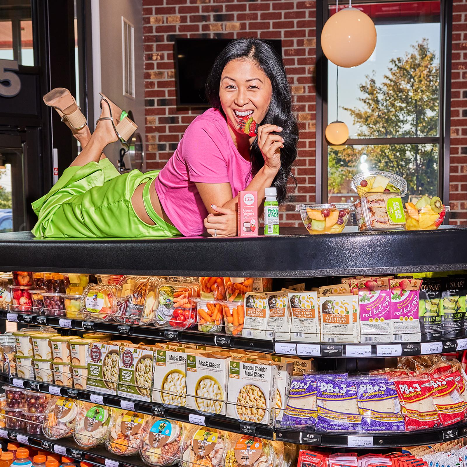 woman sitting on top of a Sheetz MTGO cooler