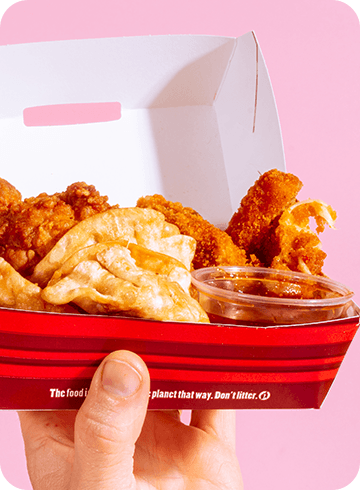 Appetizer Sampler being held up in front of a pink background