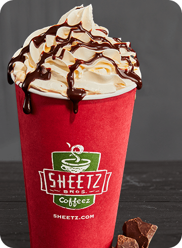 hot chocolate with whipped cream on a dark background