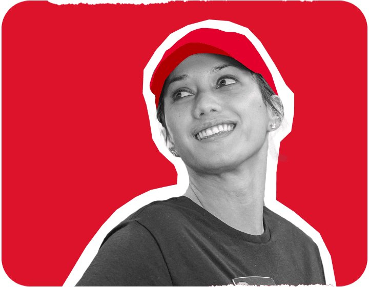 Girl posing in front of a red background