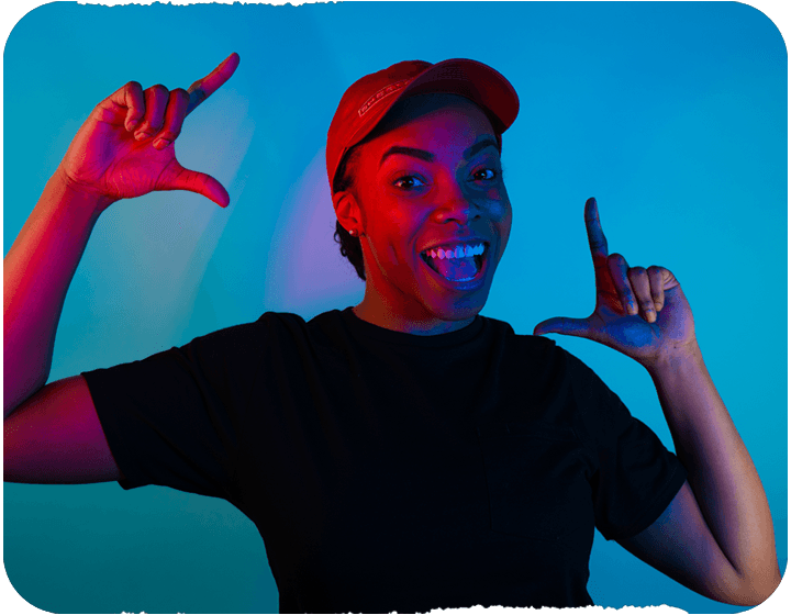 female sheetz employee posing on a blue background