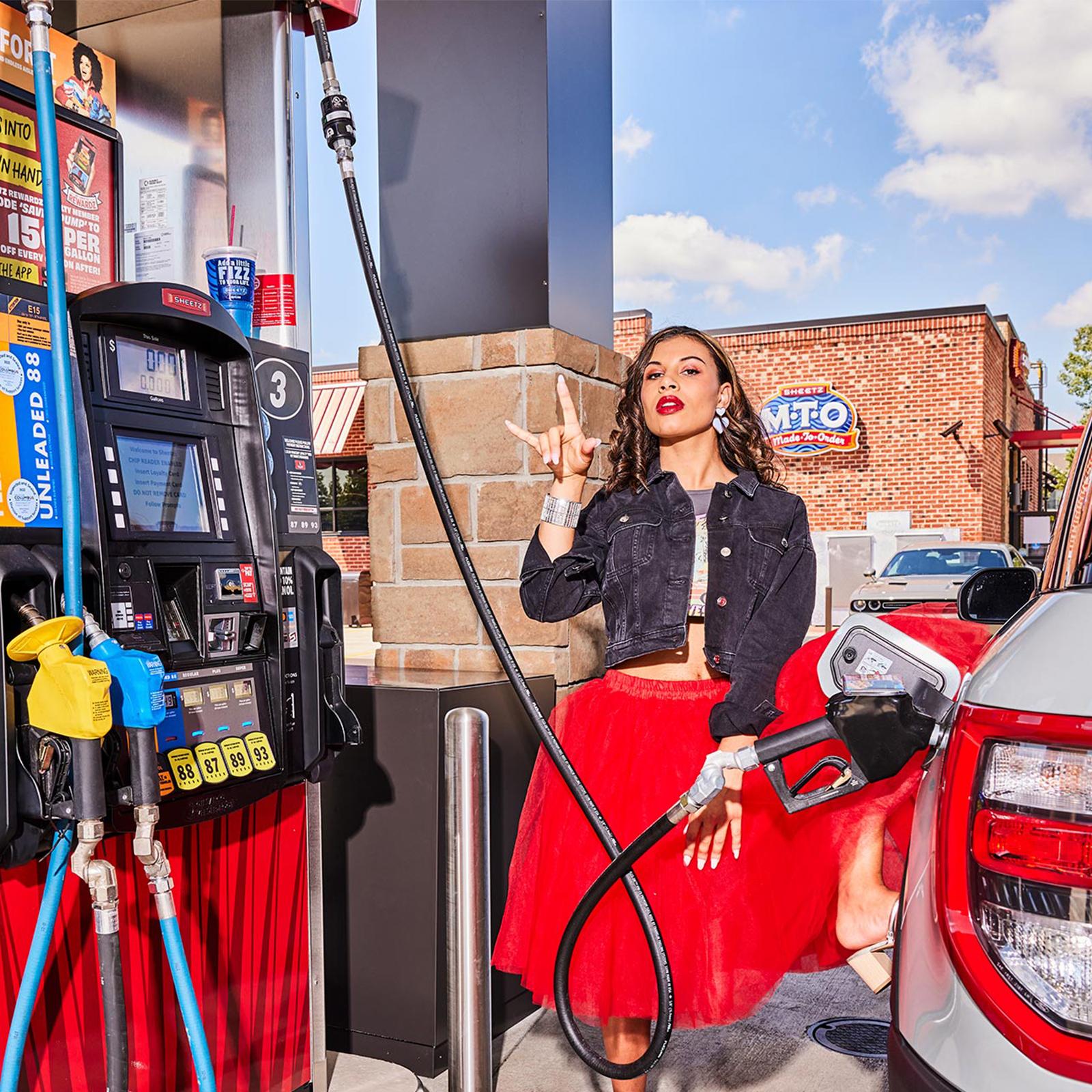 woman filling up her car with gas from Sheetz