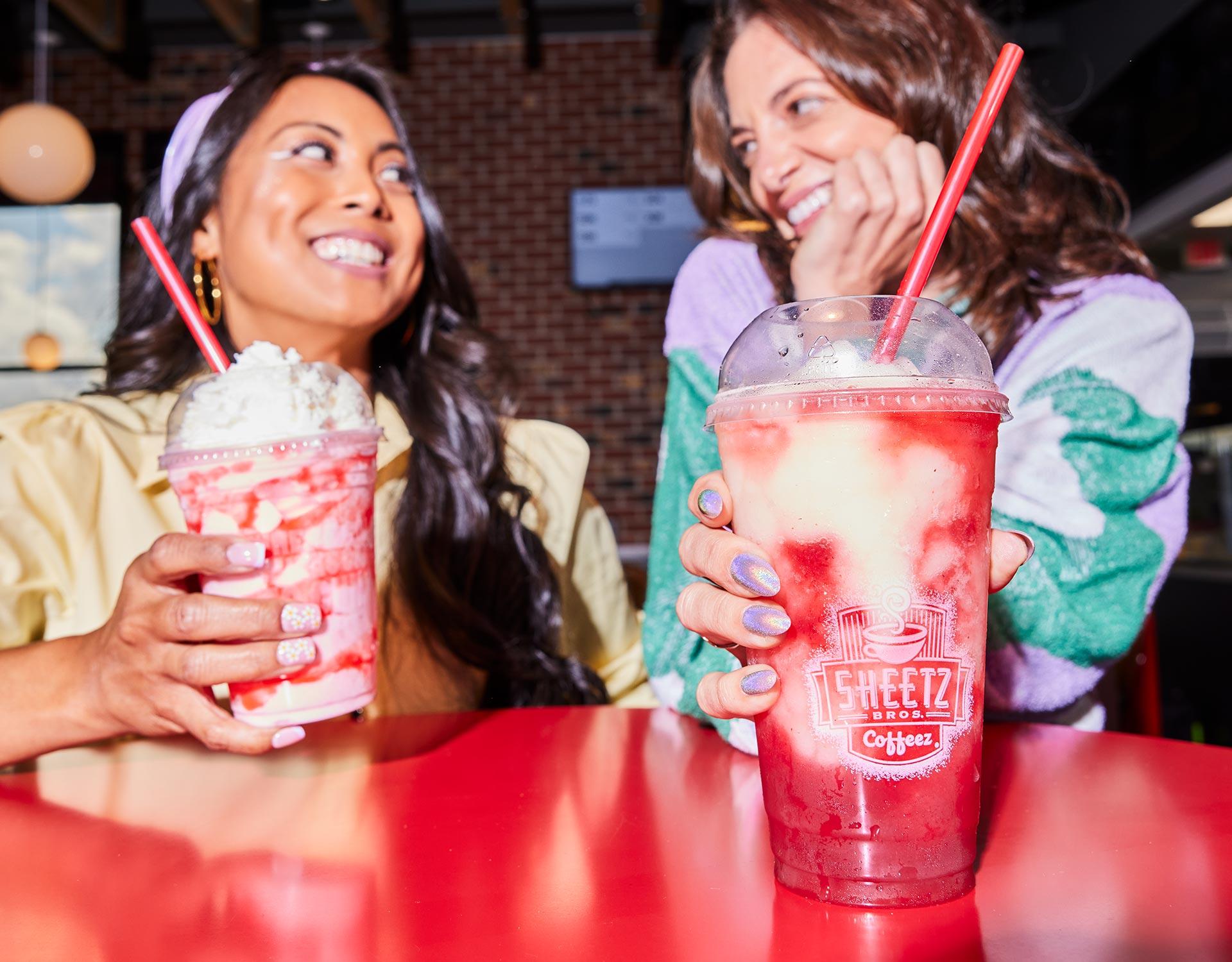 two girls drinking sheetz smoothies